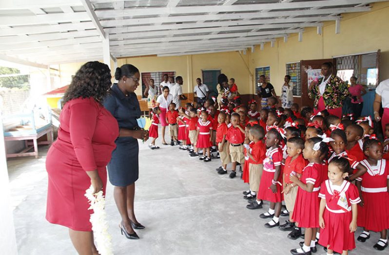 Minister Henry addressing students during her visit to one of ten schools on Monday