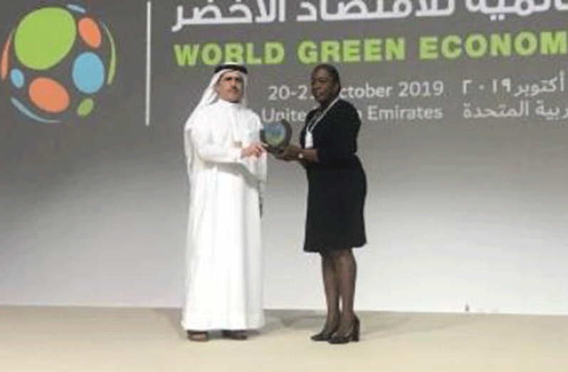 Education Minister, Dr. Nicolette Henry
eceiving her award (DPI photo)