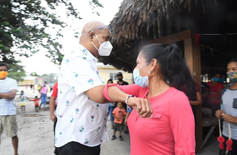 Minister of Public Works, Bishop Juan Edghill, being greeted by St. Cuthbert’s Mission Toshao, Ms. Beverly Clenkian