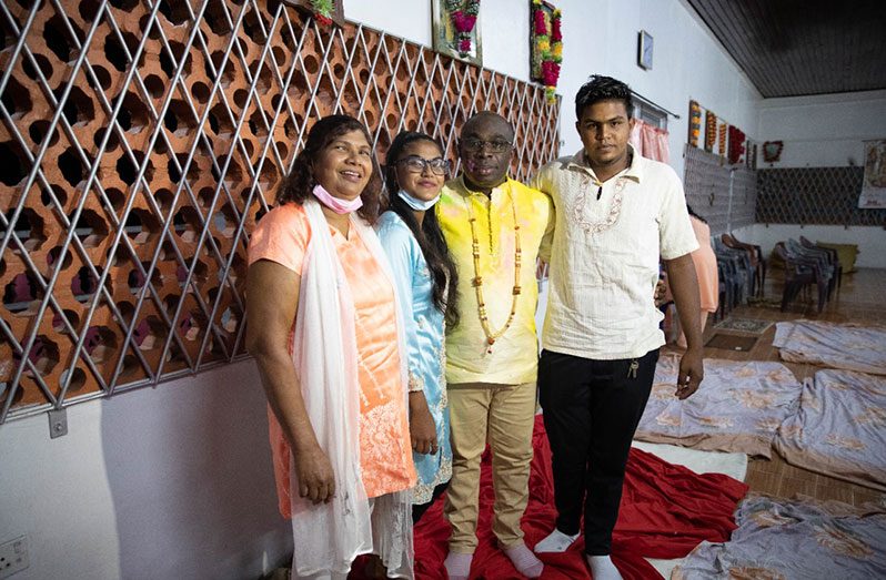 Minister within the Office of the Prime Minister with responsibility for Public Affairs, Kwame McCoy with members of the Hope Mandir (DPI photo)