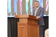 Minister of Public Utilities and Aviation Deodat Indar delivers remarks