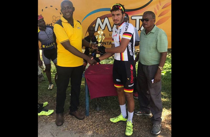 Team Evolution’s Paul `Mole’ DeNobrega (second right) accepts his award from a representative of Banks DIH while, looking on at extreme right is race organizer, Hassan Mohamed.