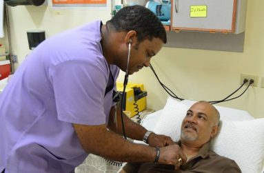 Nurse Moseley assisting a patient