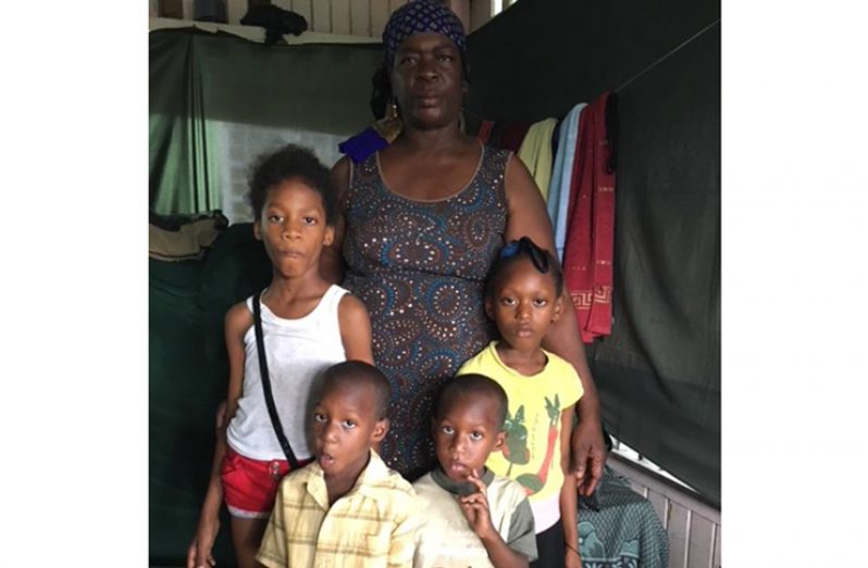 Jacqueline Collins with her grandchildren