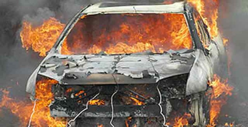A motor car on fire.