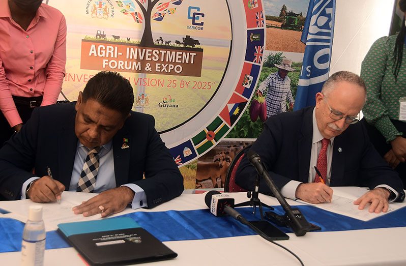 Agriculture Minister, Zulfikar Mustapha and FAO’s Assistant Deputy-Director for Latin America and the Caribbean, Dr. Julio Berdegue, sign their respective agreements