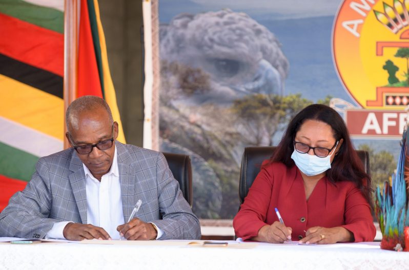 Labour Minister, Joseph Hamilton and Amerindian Affairs Minister, Pauline Sukhai, signing the Memorandum of Understanding to jump start the $39.2M training programme for hinterland youths and CSOs