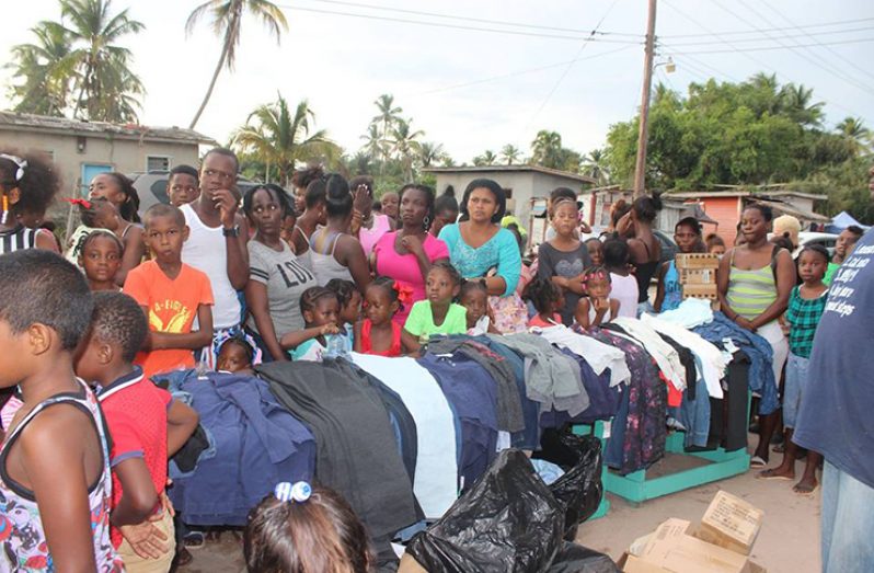 Figueira and his team distributing clothing to the residents of Blue Berry Hill