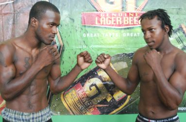 Jamaica’s Sakima Mullings (left) and Guyana’s Derrick Richmond strike a pose for photographer Cullen Bess-Nelson shortly after yesterday’s press conference at Banks DIH Sports Club, Thirst Park.