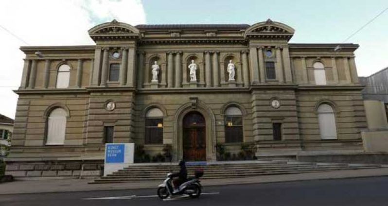 A motorcyclist drives past the Kunstmuseum Bern art museum in the Swiss capital of Bern May 7, 2014.