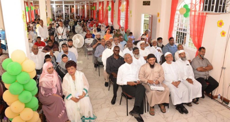 The gathering at the launch of he new Guyana Islamic Trust (GIT) Secretariat and the ISA Elementary School building. In the front row at the right of President David Granger is Minister of Social Cohesion, Amna Ally.  (From left in the front row) Nazar Mohamed of Mohamed's Enterprise, Former President of the GIT, Imam Mohamed Haseeb Yusuf, Head of the Political Division, Ministry of the Presidency, Frederick Mc Wilfred and President of the Guyana Islamic Trust, Shaykh Abdul Aleem Rahim