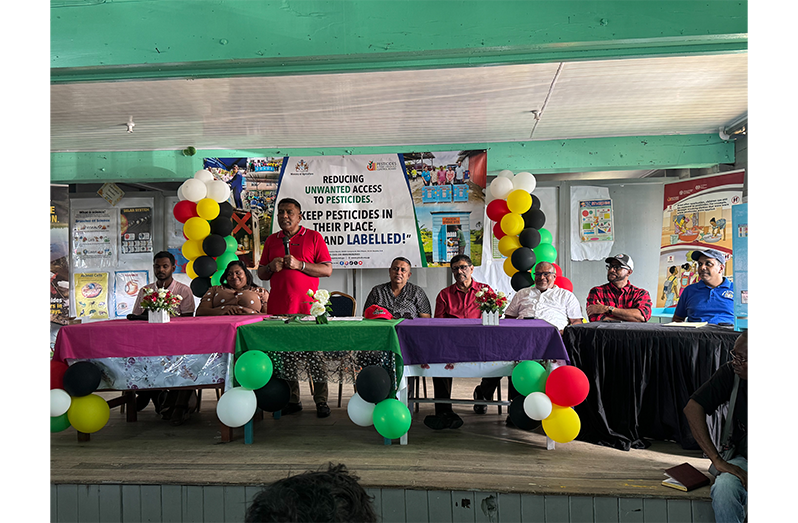 Agriculture Minister Zulfikar Mustapha speaking to farmers about the importance of pesticide safety and responsible chemical storage