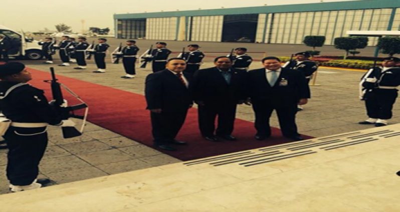 Prime Minister, Moses Nagamootoo being greeted by Mexican officials