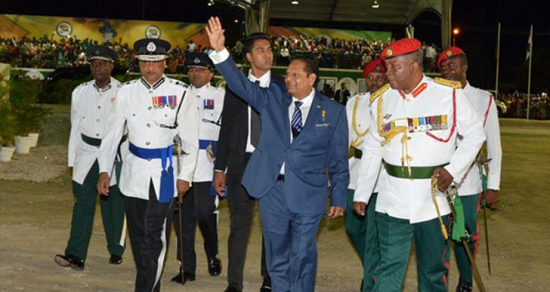Prime Minister, Moses Nagamootoo waves to the crowd as was being escorted by heads of the disciplined forces Wednesday night    