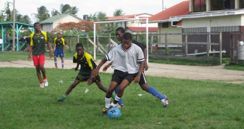 NAMS striker Jamal Butts takes possession of the ball before being shown the red card