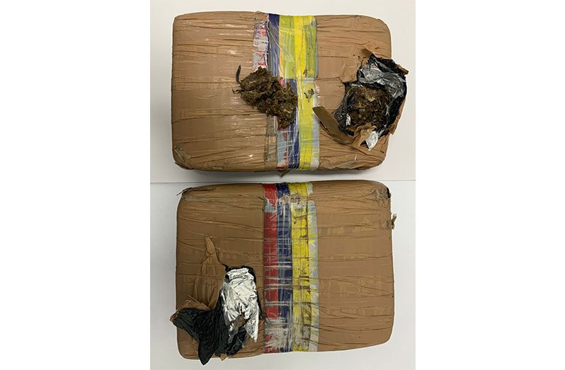 The two parcels of narcotics that were found during an intelligence-led operation near the Demerara Habour Bridge (GPF photo)