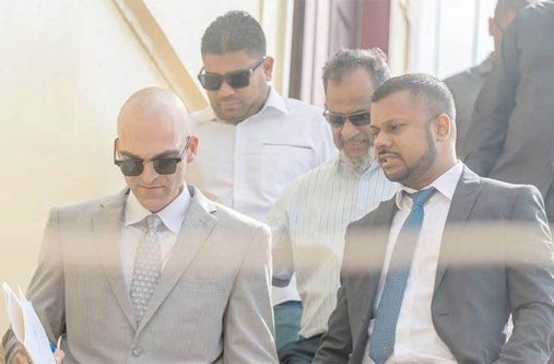Nazar and Azruddin Mohamed pictured with their attorneys, Siand Dhurjon and Damien Da Silva  (Delano Williams photo)