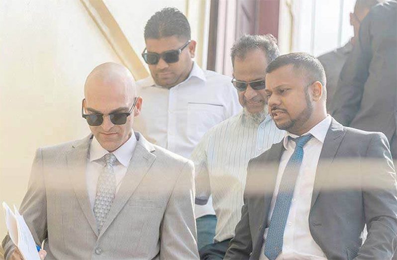 Nazar and Azruddin Mohamed pictured with their attorneys, Siand Dhurjon and Damien Da Silva  (Delano Williams photo)