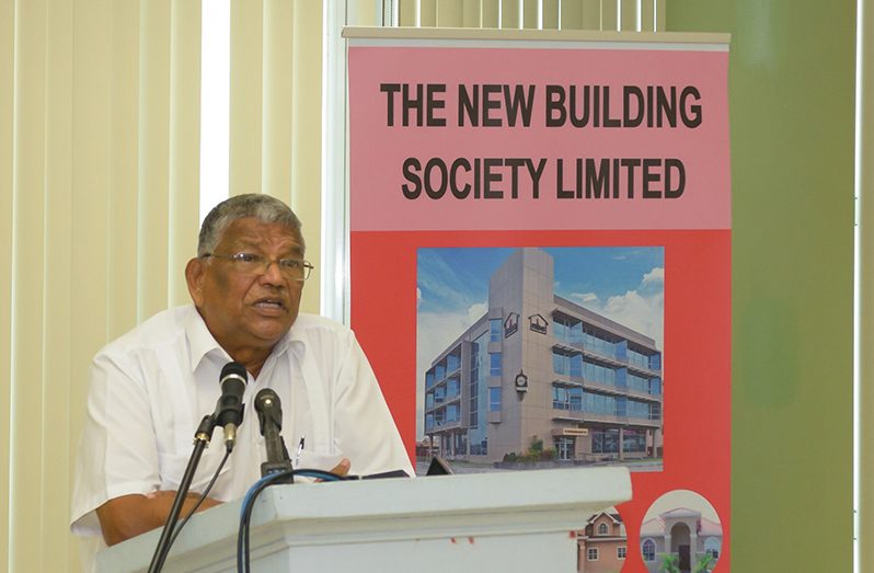 NBS Chairman, Nanda Gopaul addresses the media conference as the Society’s leadership looks on from the head table (Delano Williams photo)
