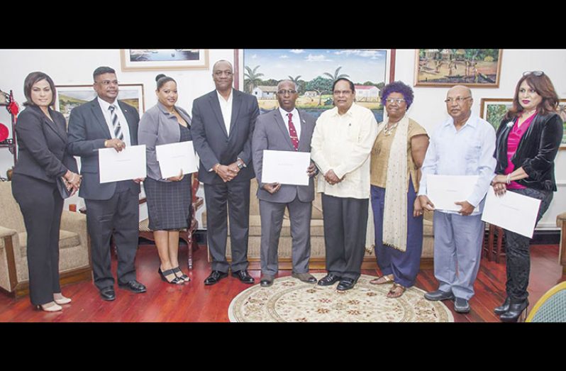 From L-r- GNBA's CEO Dr Prudence Lewis-Bhola, Joel Edmond, Aretha Nicola Campbell, Minister of State Joseph Harmon, Chairman of GNBA Lt. Col Leslie Anthony Sobers, Prime Minister Moses Nagamootoo, Jocelyn Josiah, Dr Rovin Deodat and Scheherazade Ishoof - Khan