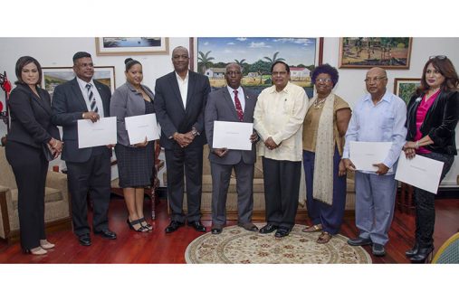 From L-r- GNBA's CEO Dr Prudence Lewis-Bhola, Joel Edmond, Aretha Nicola Campbell, Minister of State Joseph Harmon, Chairman of GNBA Lt. Col Leslie Anthony Sobers, Prime Minister Moses Nagamootoo, Jocelyn Josiah, Dr Rovin Deodat and Scheherazade Ishoof - Khan