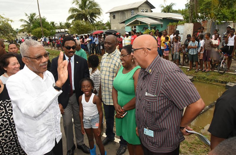 President David Granger and his wife Mrs Sandra Granger greet residents of Sophia, while Attorney General, Basil Williams; Minister within the ministry of
Natural Resources, Simona Broomes; GWI, Managing Director, Richard Van-West Charles and other officials look on (Adrian Narine photo)