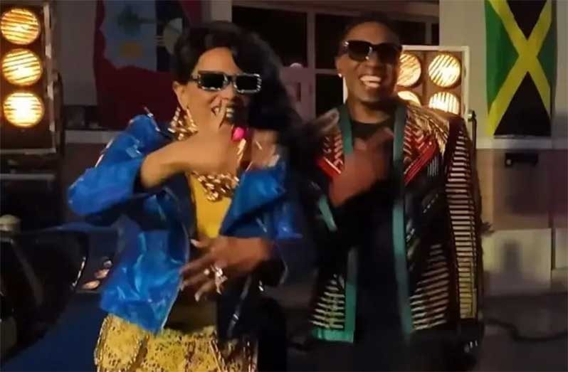 Screengrab of a promotional video showing DJ Bravo and Angie