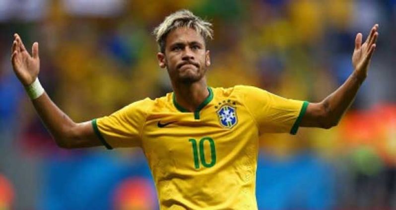 Neymar of Brazil celebrates scoring his team's second goal and his second of the game during the 2014 FIFA World Cup Brazil Group A match between Cameroon and Brazil at Estadio Nacional, yesterday in Brasilia, Brazil. (Photo by Clive Brunskill/Getty Images)