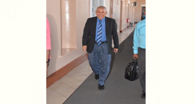 Public Health Minister Dr George Norton making his way into the Parliament Chambers