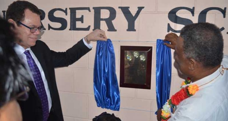Prime Minister, Samuel Hinds and President of the Caribbean Development Bank, Dr. William Warren Smith unveiling the plaque at the commissioning of the Tuschen Nursery School