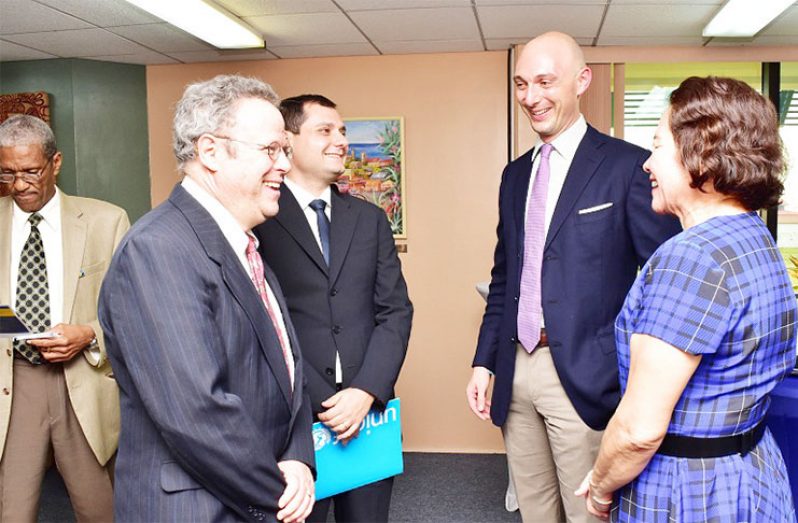 First Lady, Mrs. Sandra Granger (first, right) shares a light moment with from left to right: Professor Rafael Perez-Escamilla, one of the 19 authors of The Lancet Series, Mr. Vincenzo Placco, Education Specialist, UNICEF Latin America and the Caribbean Regional Officer; and Mr. Paolo Marchi, Deputy Representative, UNICEF, Guyana and Suriname. Dr. Douglas Salter, Assistant Secretary General, Human and Social Development, Caribbean Community Secretariat is also pictured background, first left.
