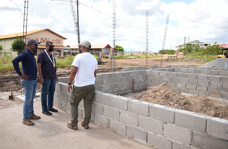 Housing and Water Minister, Collin Croal, with other officials inspecting the construction site for the new CH&PA and GWI office building in Lethem, Region Nine