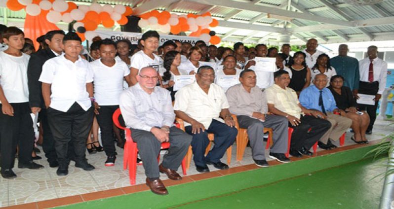 Minister of Labour, Dr. Nanda Gopaul (second left) along with other officials and the graduating class