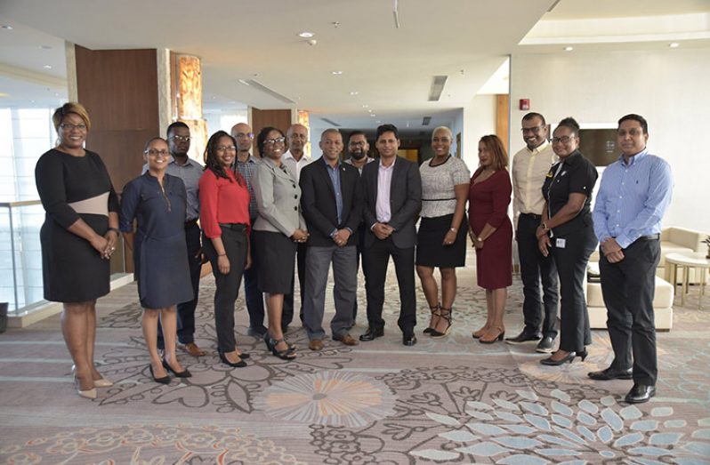 Director of Energy, Dr Mark Bynoe and members of the American Chamber of Commerce