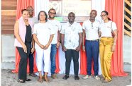 Minister within the Office of the Prime Minister Kwame McCoy with officials of OM Woodworking Guyana Incorporated
