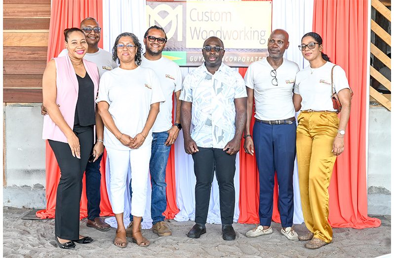Minister within the Office of the Prime Minister Kwame McCoy with officials of OM Woodworking Guyana Incorporated