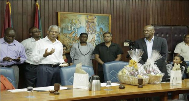 President David Granger addressing staff of the Office of the President. At right is Mr Joe Harmon, acting Head of the Presidential Secretariat