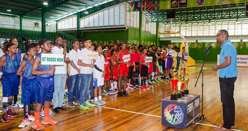 Director of Sport Christopher Jones addressing the teams at yesterday’s opening ceremony.  (Delano Williams photos)