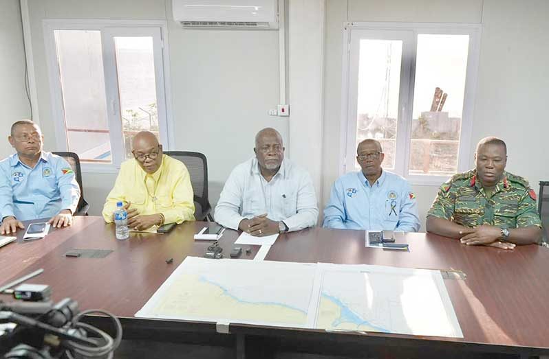 Prime Minister Brigadier (Ret’d) Mark Phillips (centre) along with officials as they briefed the media at the Maritime Rescue Coordination Centre (Sachin Persaud photo)