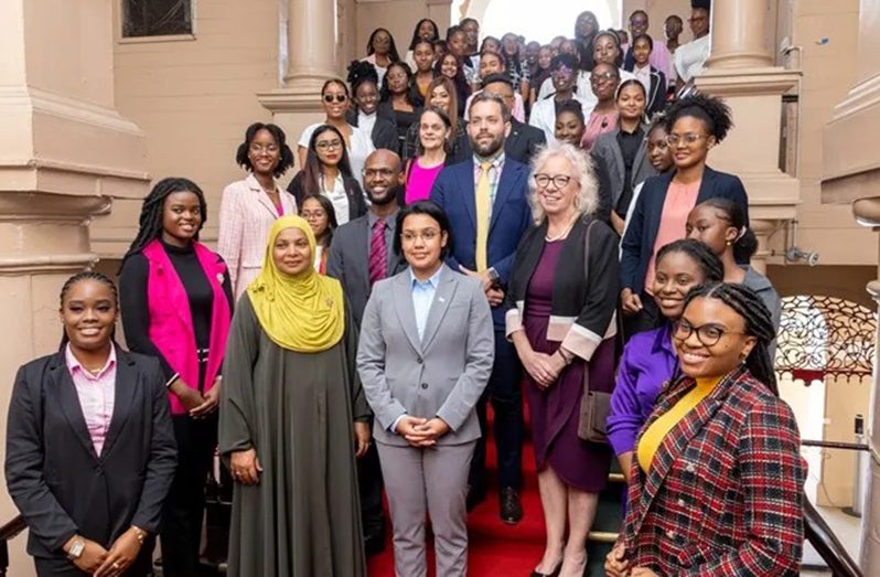 Minister within the Ministry of Housing and Water, Susan Rodrigues (standing at centre), along with members of the diplomatic corps and participants of the National Assembly of Girls (DPI photo)