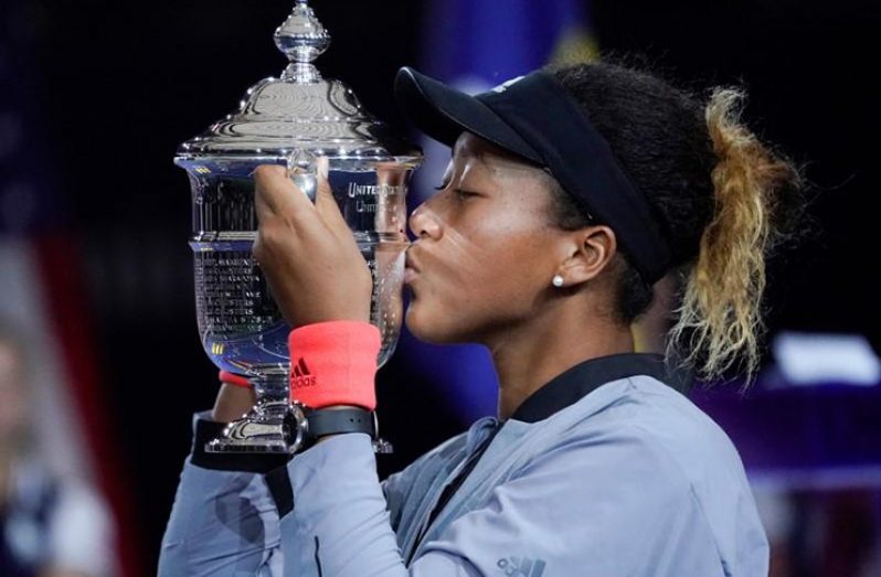 Naomi Osaka of Japan kisses the U.S. Open trophy after beating Serena Williams of the USA in the women’s final on day 13 of the 2018 U.S. Open tennis tournament at USTA Billie Jean King National Tennis Center, New York, NY, USA; (Mandatory Credit: Robert Deutsch-USA TODAY Sports)