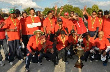 The victorious Our Own Sports Club players pose after their third consecutive championship win.
