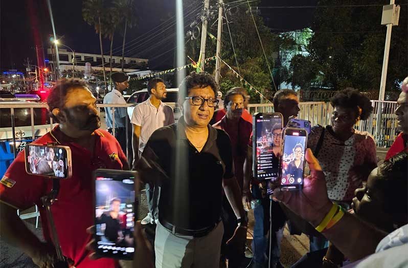 Attorney General and PPP/C Candidate Anil Nandlall speaking to the media on Friday evening outside of GECOM headquarters