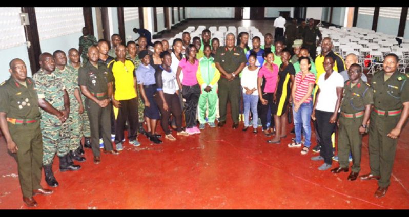 The athletes pose with the CoS (at centre) and other senior GDF officers.
