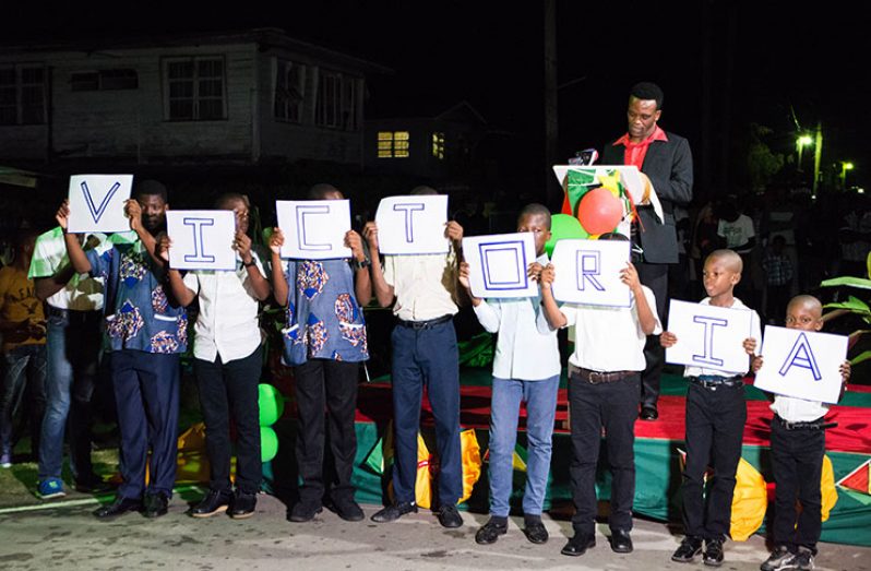 Victoria youths captivated the audience with their acrostic during Monday evening’s event (Terrence Collins photo)