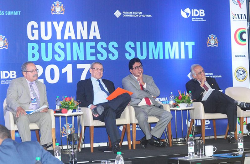 From left: Local economist from the Inter-American Development Bank, Mark Wenner; Guyana Revenue Authority (GRA) Commissioner General, Godfrey Statia; former Attorney General, Anil Nandlall and Attorney-at-Law Christopher Ram during the panel discussion at the Business Summit on Thursday
