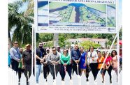 First Lady Arya Ali (centre), partners and residents at the Anna Regina Independence Park which will soon benefit from a facelift. Also pictured is a billboard with an artist’s impression of what the park is expected to look like