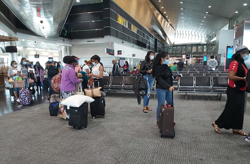 Guyanese passengers as they prepared to check in at the Miami International Airport earlier on Saturday ( John Ramsingh photo)