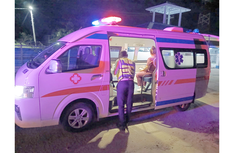 Emergency personnel preparing to take  Fazal Azeez to the hospital