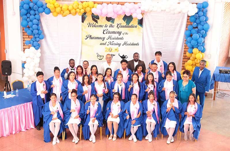 Health Minister, Dr. Frank Anthony, flanked by PCA programme graduates and other officials in Region Nine last year